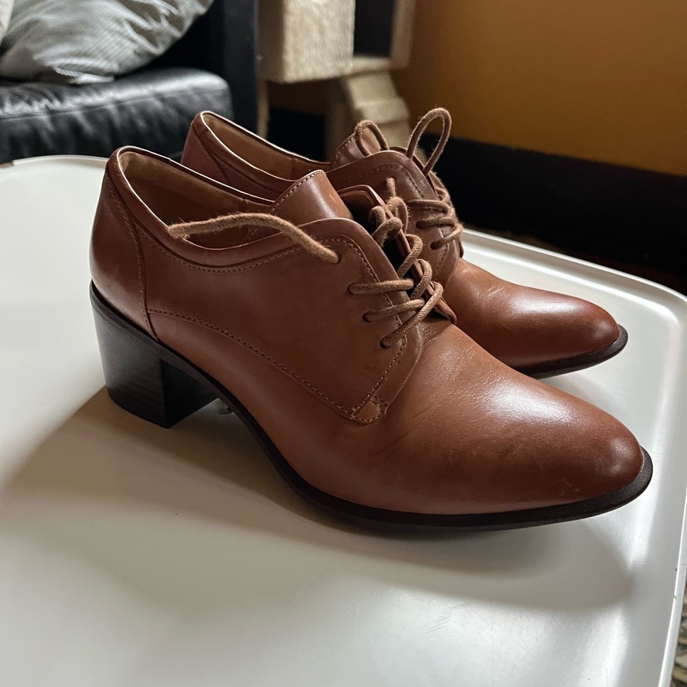 Brown leather lace-up oxfords with a heel
